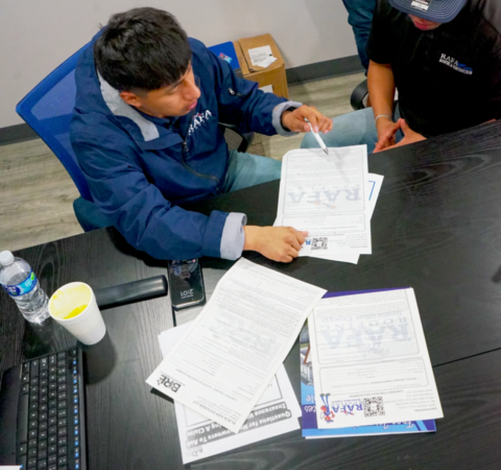 man pointing at paper
