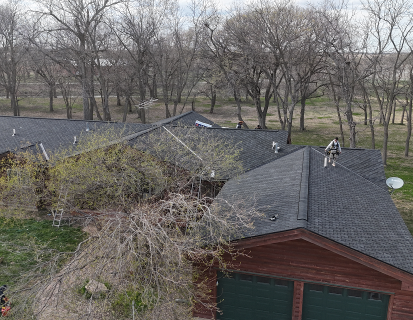 Man standing on roof.